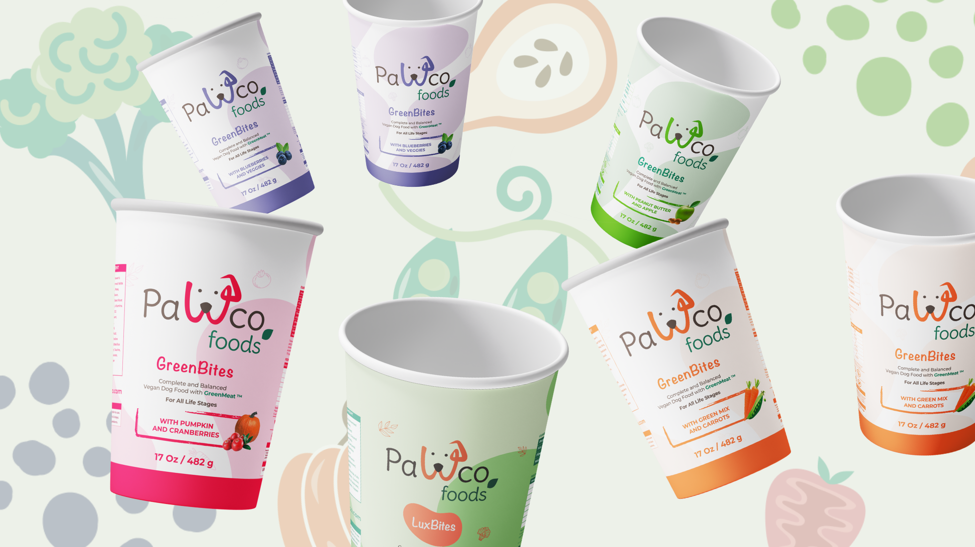 The image shows PawCo's GreenBites and LuxBites packaging against a background with various vegetable illustrations.